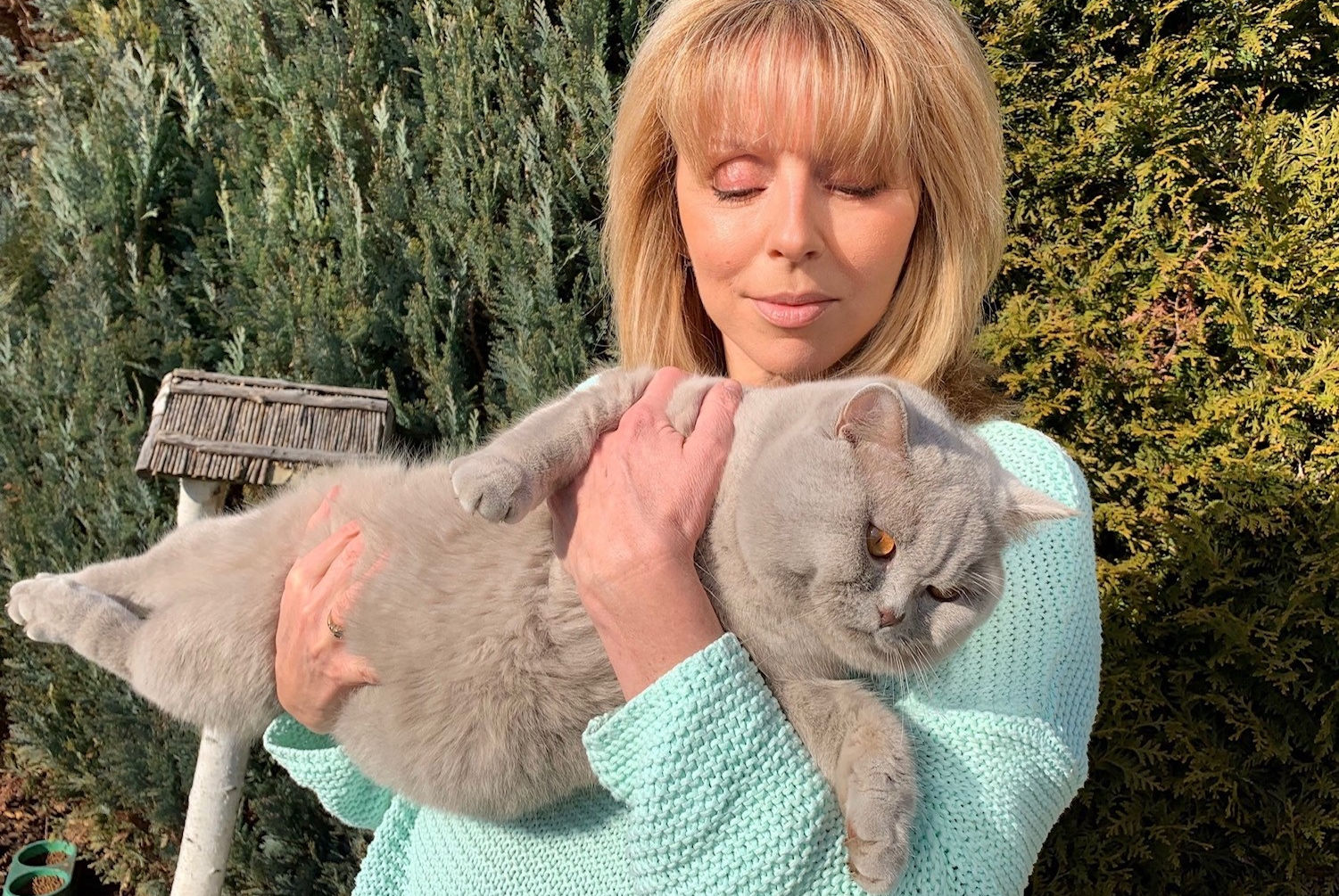 Cattery owner with cats